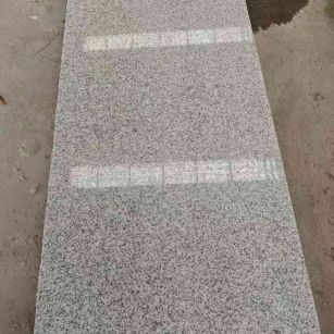 云南芝麻白光面毛板